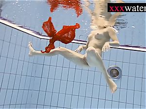sexy red-hot doll swimming in the pool